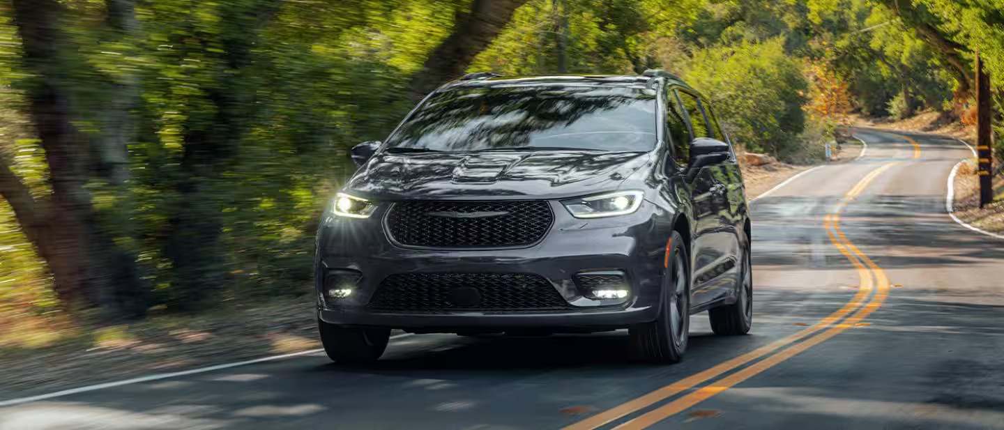 A 2026 Chrysler Pacifica driving down road in Baraboo, WI