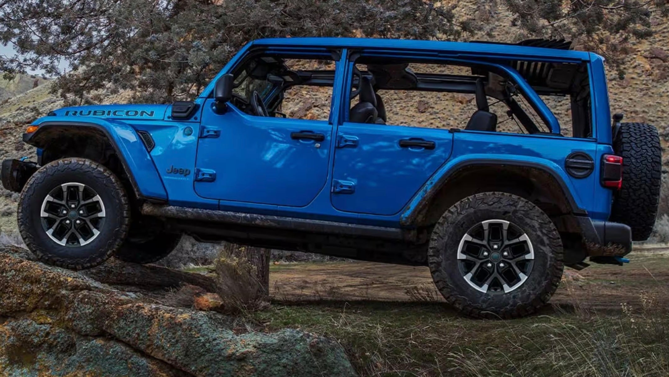 Blue Jeep Wrangler parked in the wilderness in Baraboo, WI