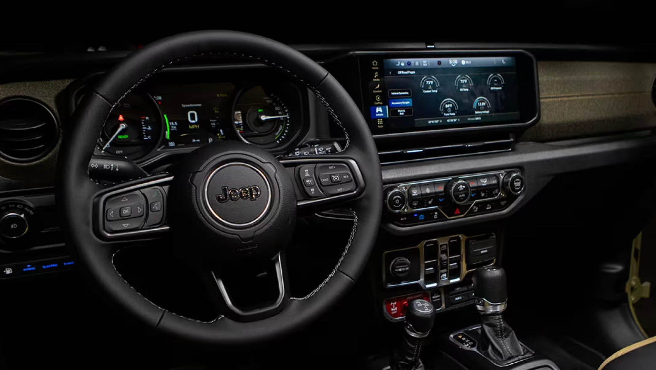 A Jeep Wrangler interior dashboard showing the latest technology and safety featrures.
