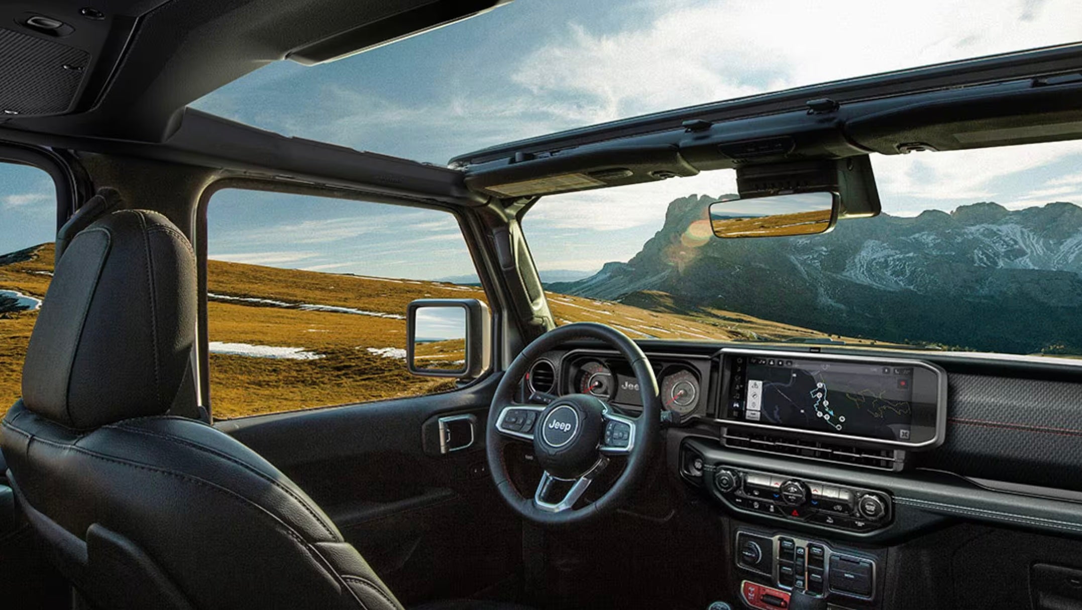 Steering wheel and dashboard of Jeep Rubicon.